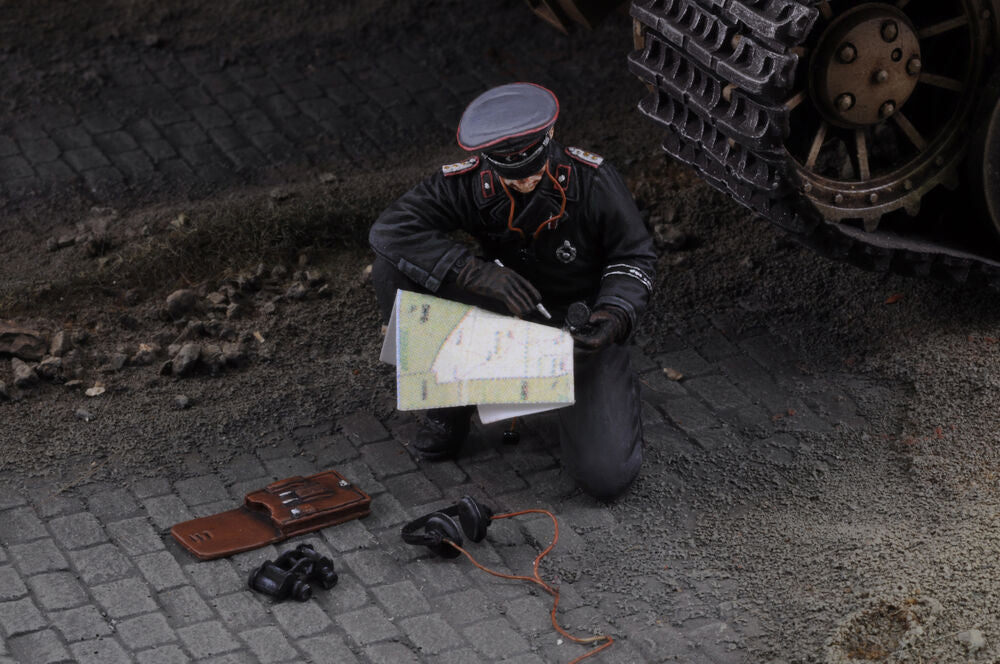 Waffen SS tank Commander with map